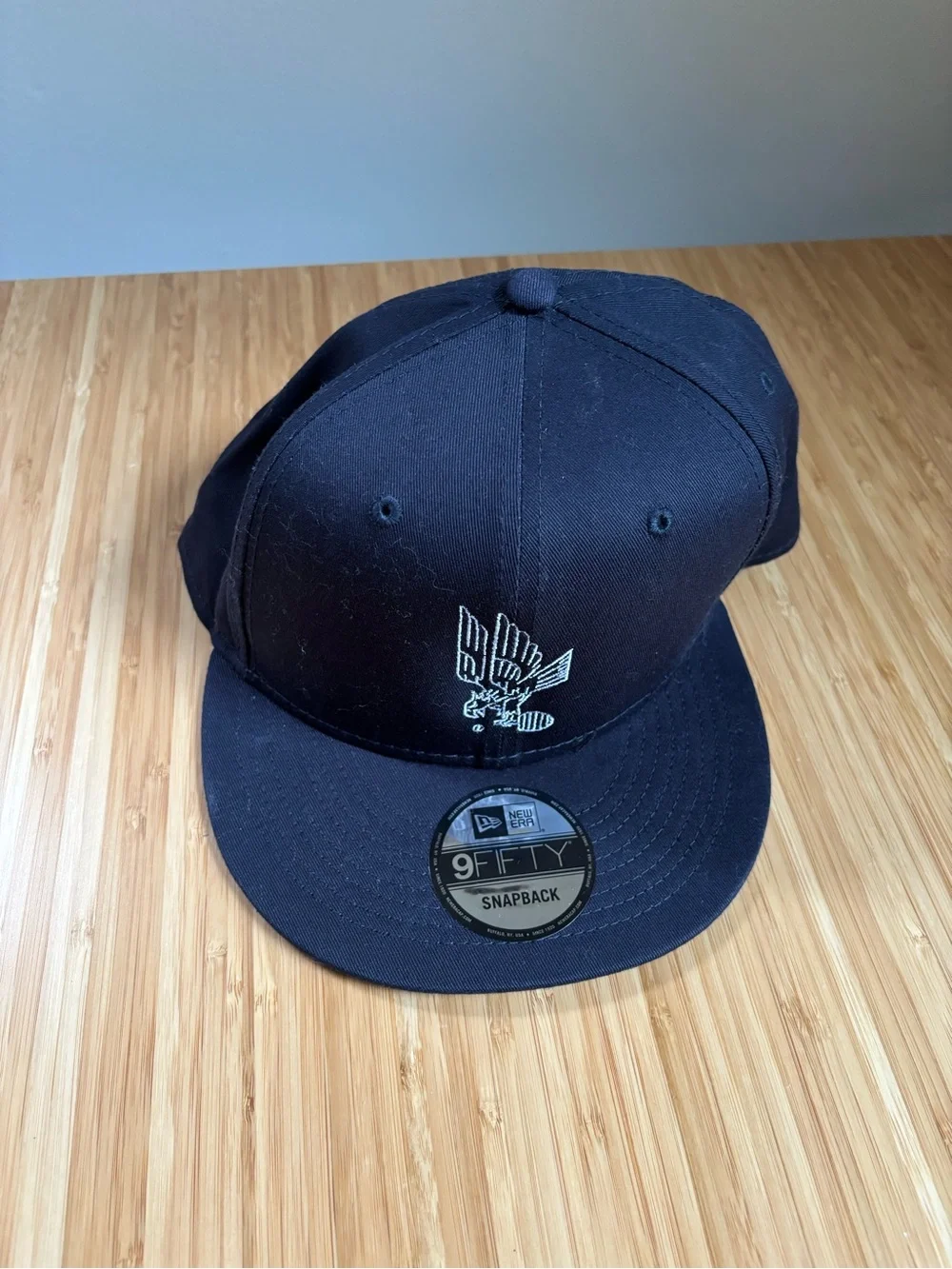 New Era Black Snapback Hat with White Eagle Patch